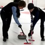 Clark County Curling sweeping