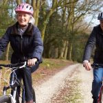 Senior Couple On Cycle Ride In Winter Countryside