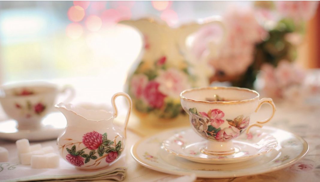 white tea set with roses on it