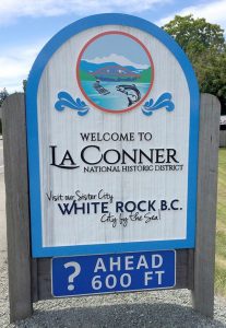 Welcome to La Conner sign greets all who visit the Washington town.