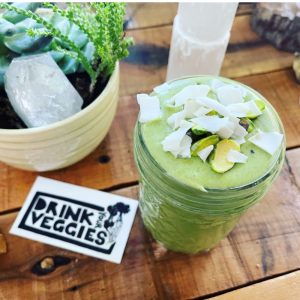 a green smoothie on a table at Cosmic Veggies, a vegan restaurant in Anacortes