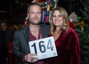 Peoples Bank district branch manager Jennifer Covey, right, poses with her husband Brian at a past Festival of Trees auction.