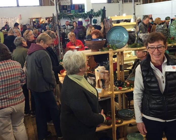 crowds of people shopping at the Anacortes Farmer Market Holiday Market