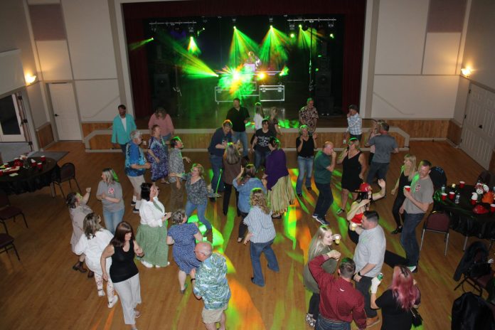 large crowd of people dancing at the La Conner Fire Association's St. Patrick's Day Dance