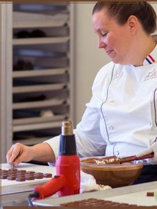 Chef Karen Neugebauer working on chocolate at Forte Chocolates in Mount Vernon