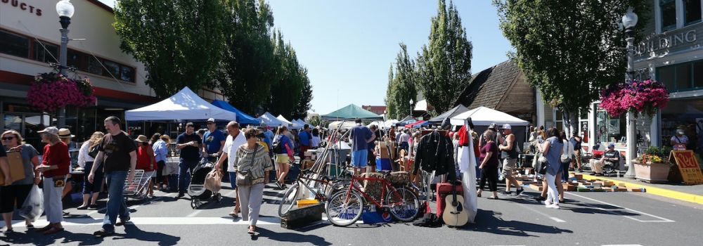 large crowd milling around pop up tents in Anacortes
