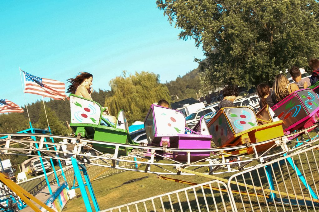 kids and adults on a rollercoaster