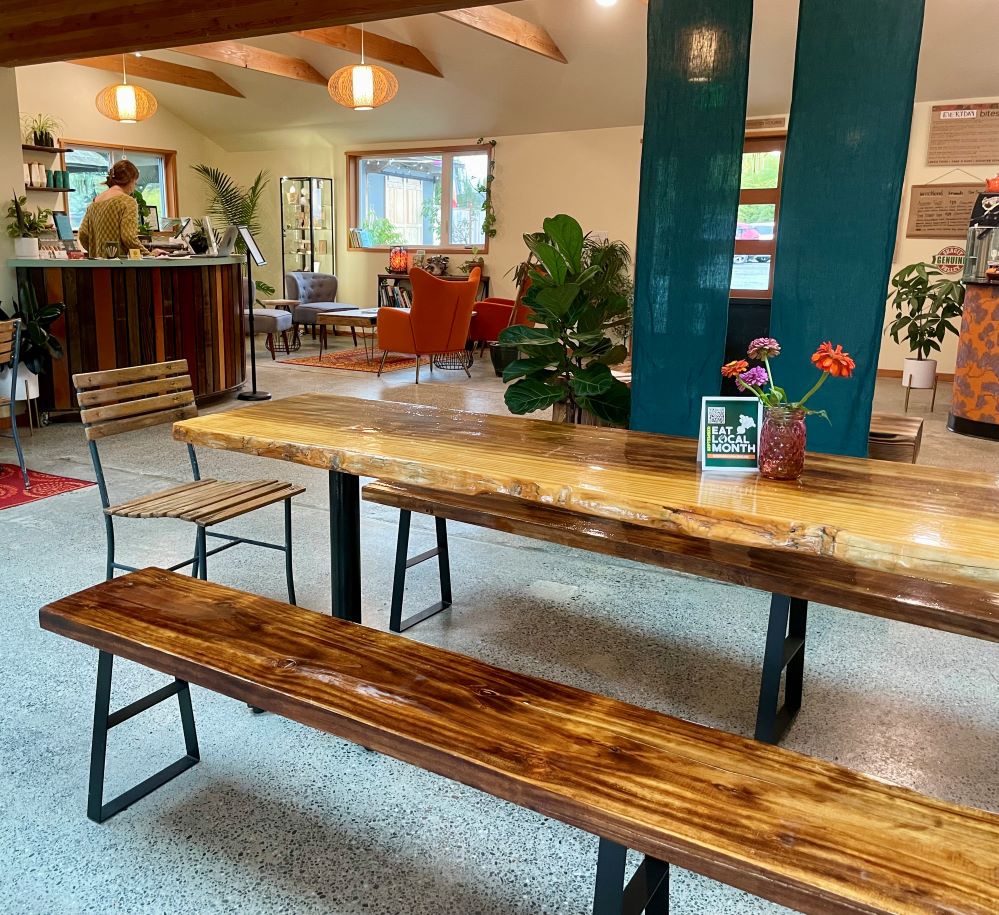 wooden picnic table inside a building
