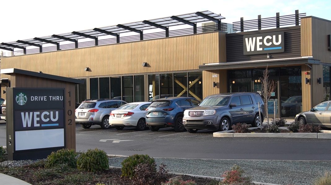 WECU Sedro Woolley Financial Center building from across the parking lot with a few cars in parked out front