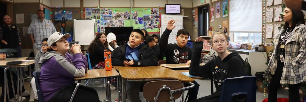 kids at desks in a school