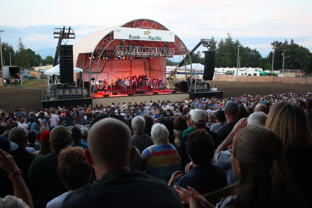 stage with people performing and huge crowd watching at the Northwest Washington Fair