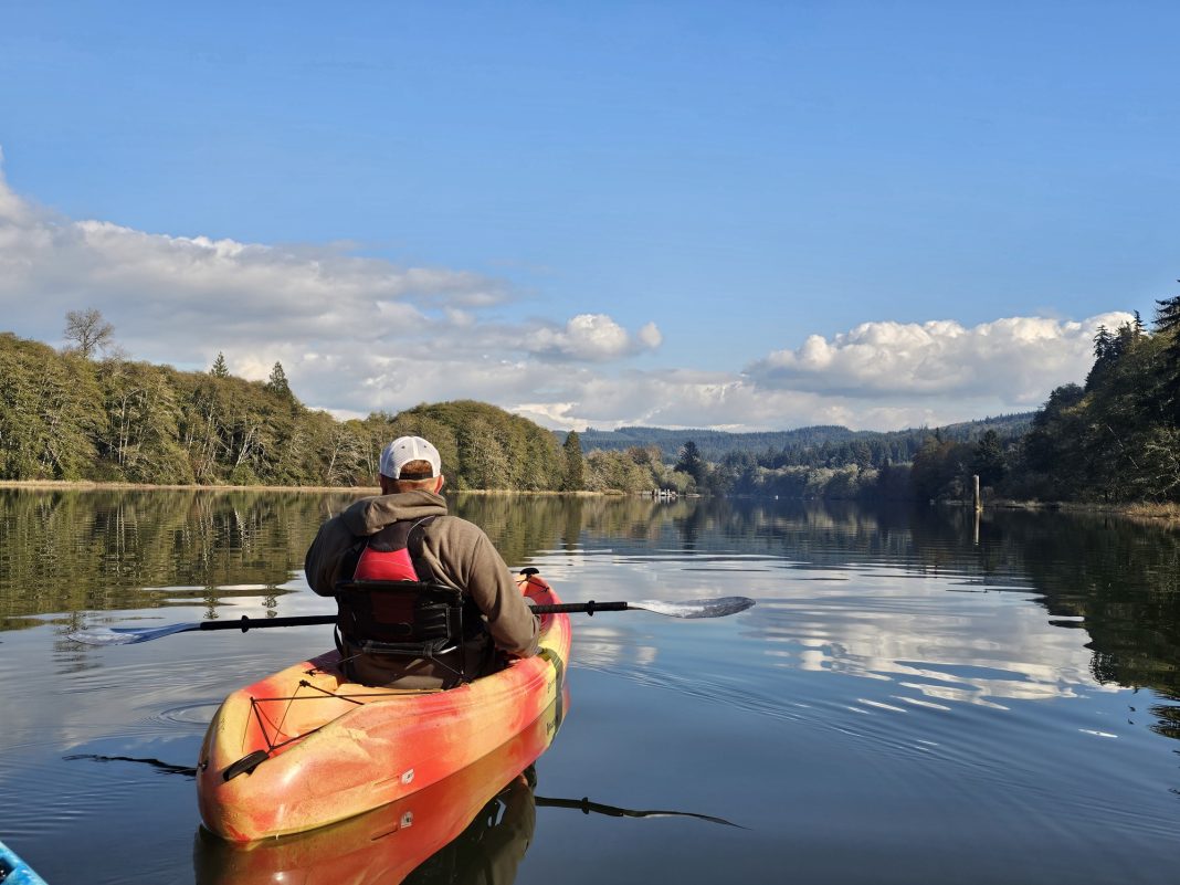 a man in an orange kayak in the Chehalis River